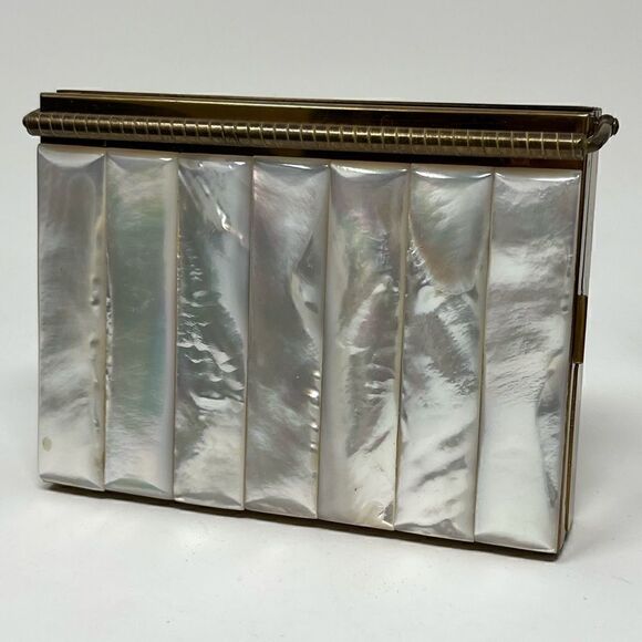 Volupte vintage MOP compact with multi compartments and original comb.